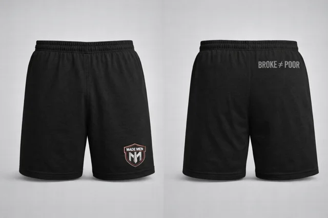 Black training shorts with shield logo and 'Broke ≠ Poor' rear print.