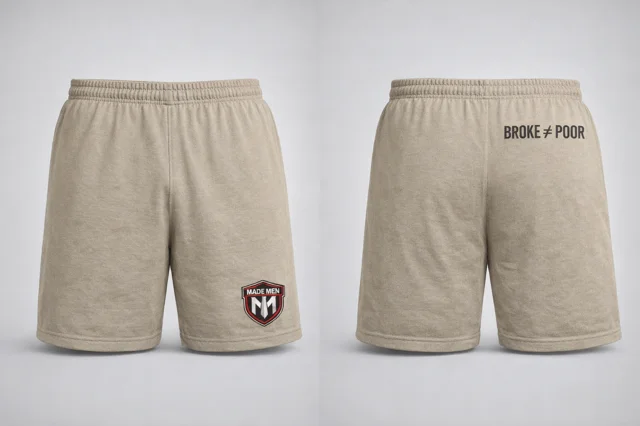 Tan heather training shorts with shield logo and 'Broke ≠ Poor' rear print.