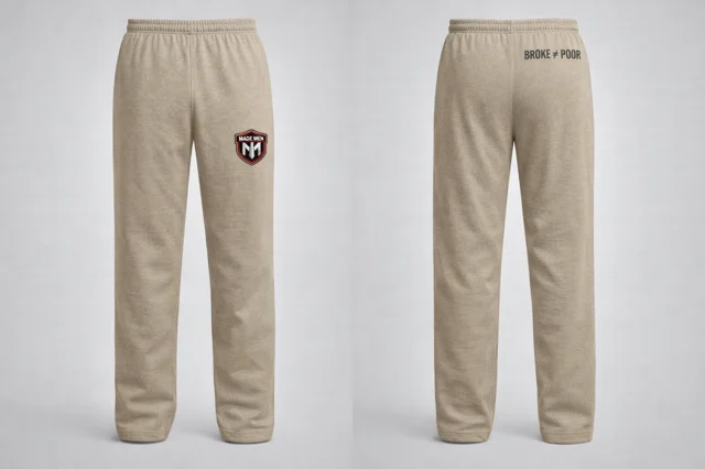 Open-hem tan sweatpants with shield logo on thigh.